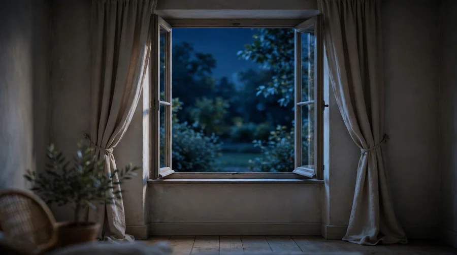 Wide open window at night in a dimly lit room to let a bat fly out
